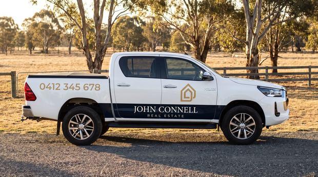 Branded vehicle livery applied to a utility